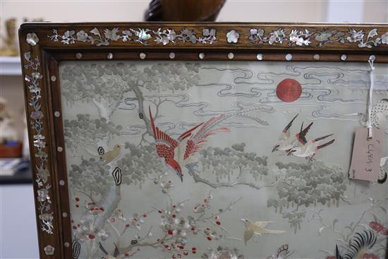 A Chinese embroidered silk, hongmu and mother of pearl framed table screen, c.1900, total size H.80cm W.62cm